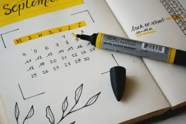 yellow marker on a planner