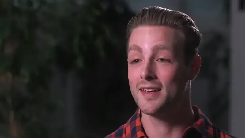 Foster child being interviewed with black background